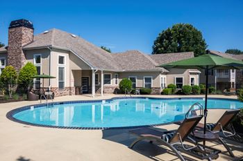 Swimming pool with lounge chairs and clubhouse
